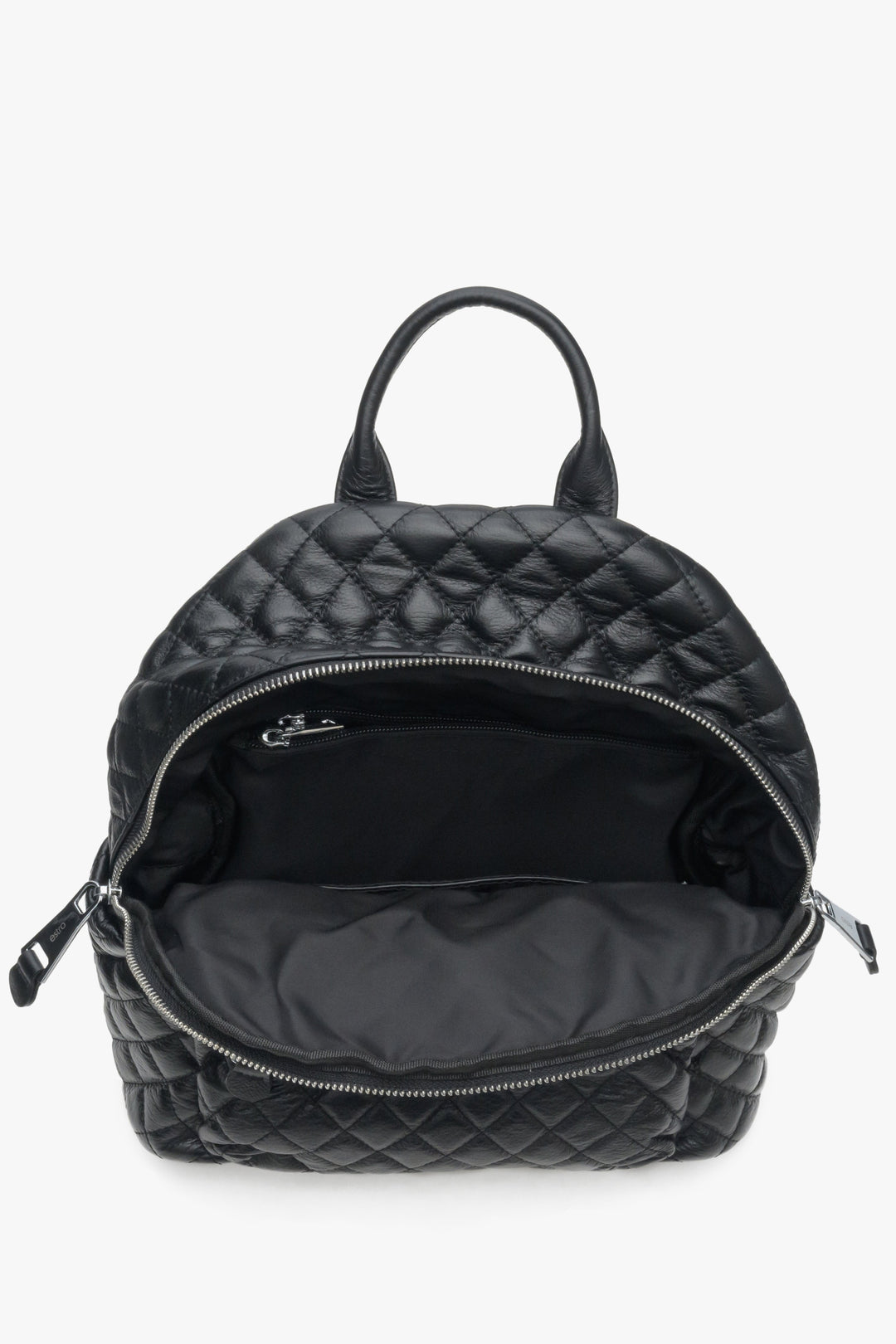 Urban, leather women's backpack in black colour - close-up of the interior of the model.