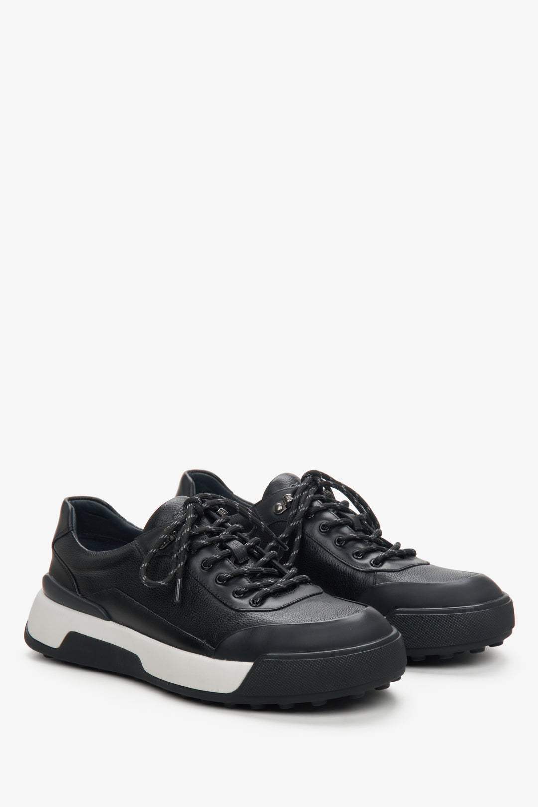 Men's black leather sneakers with a white stripe by Estro.