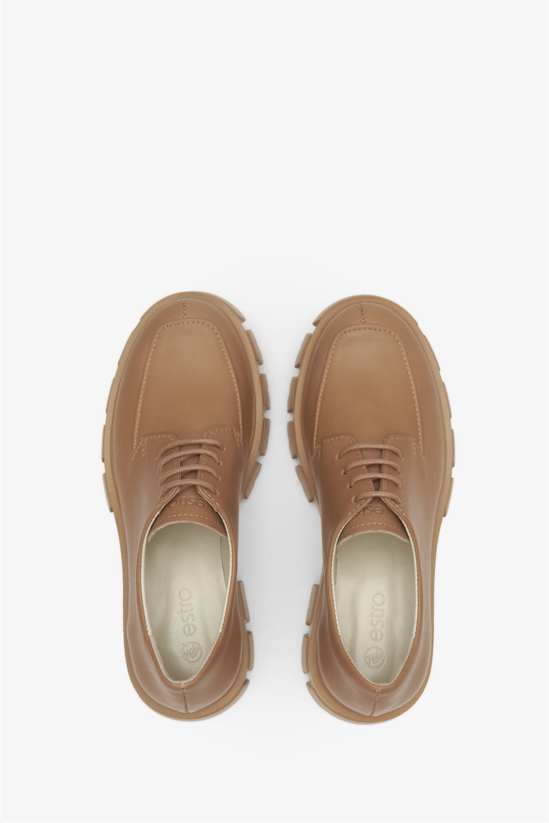 Lace-up women's leather shoes in brown - top view presentation of the footwear.