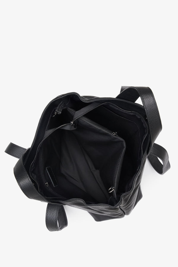 Women's black shopper-style handbag made from genuine leather by Estro - close-up on the interior of the model.