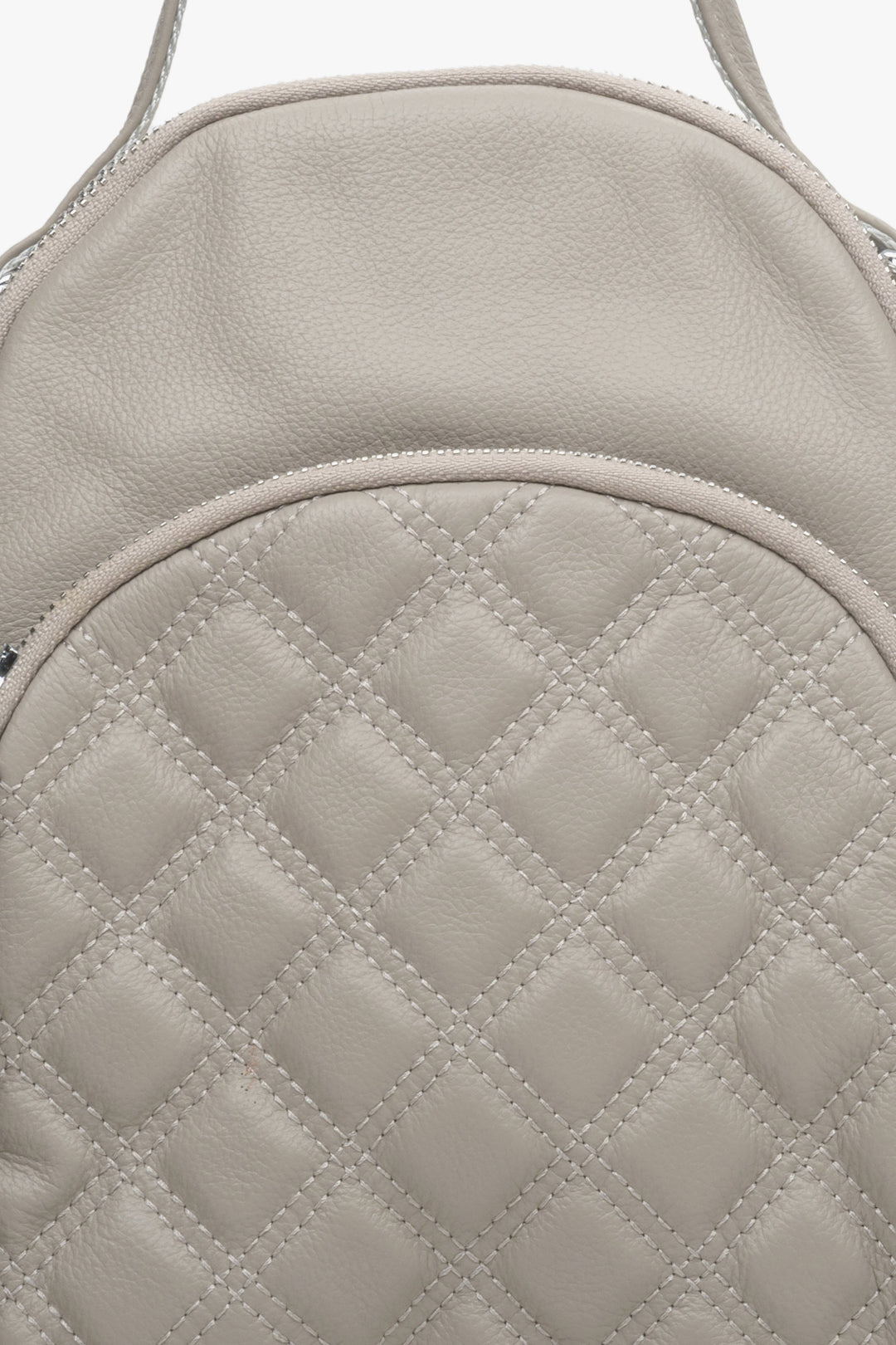 Genuine leather, small women's backpack by Estro in beige - close-up on the details.