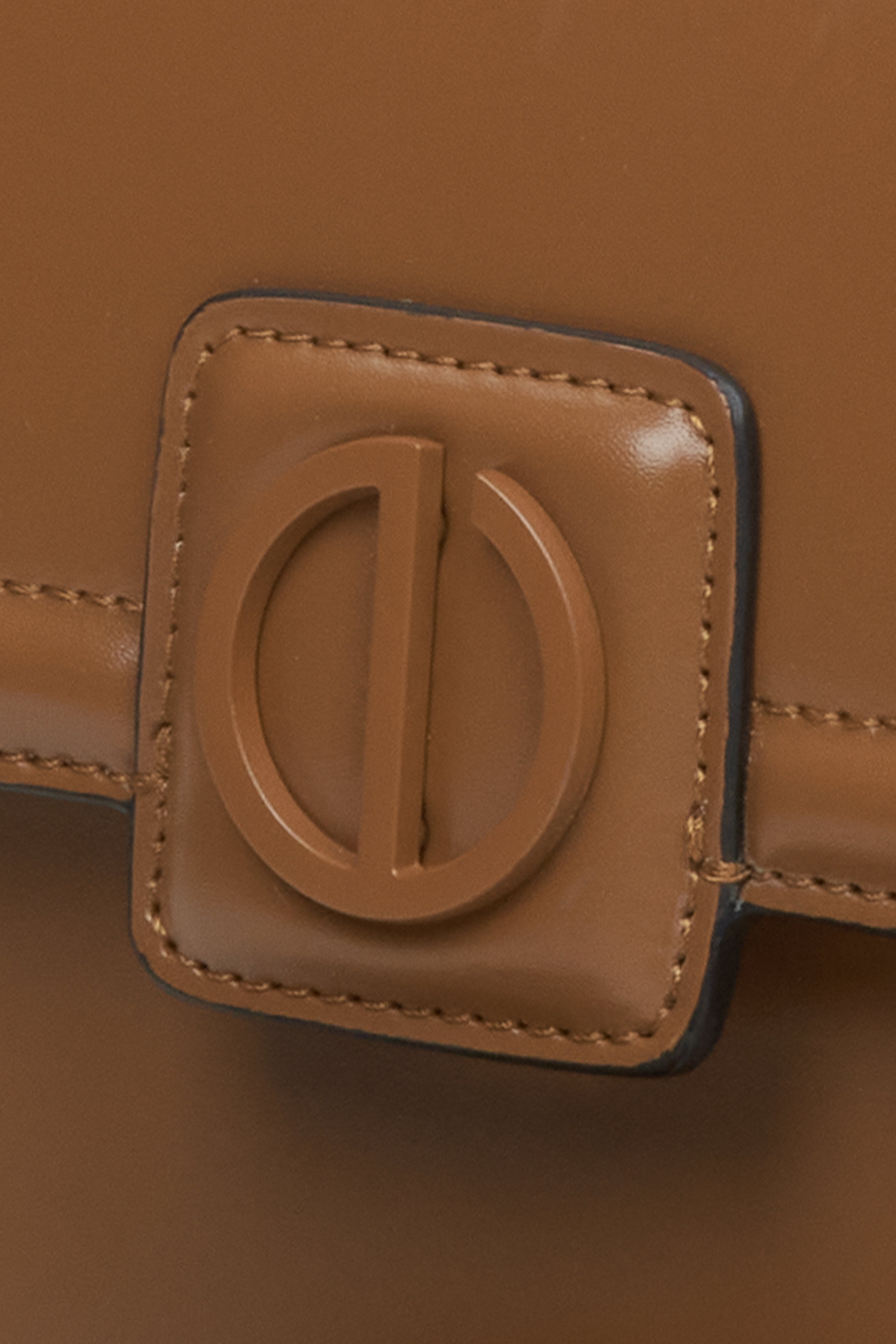 Small brown leather handbag by Estro - close-up of the detail.