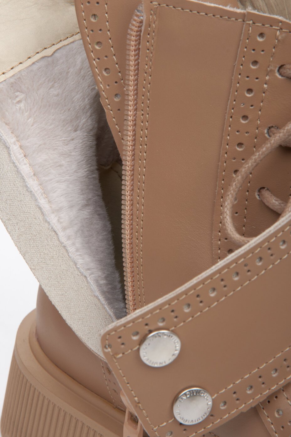 Women's leather brown winter boots with warming lining by Estro - close-up of the interior of the shoe.