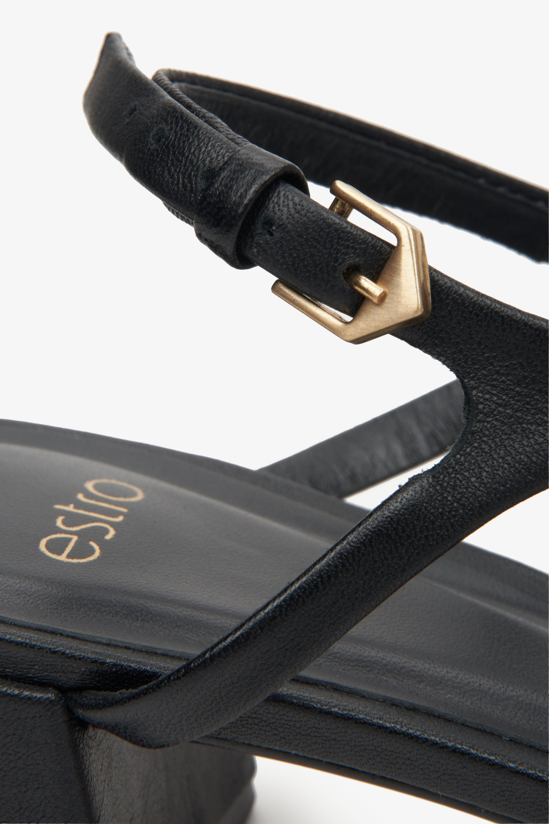 Women's black sandals made of genuine leather by Estro - close-up on details.