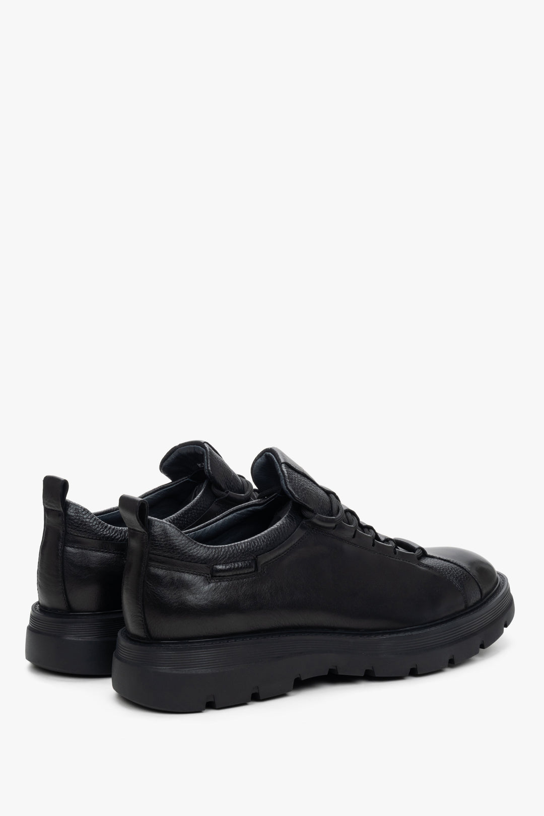 Men's black leather sneakers - close-up on the side line and heel.