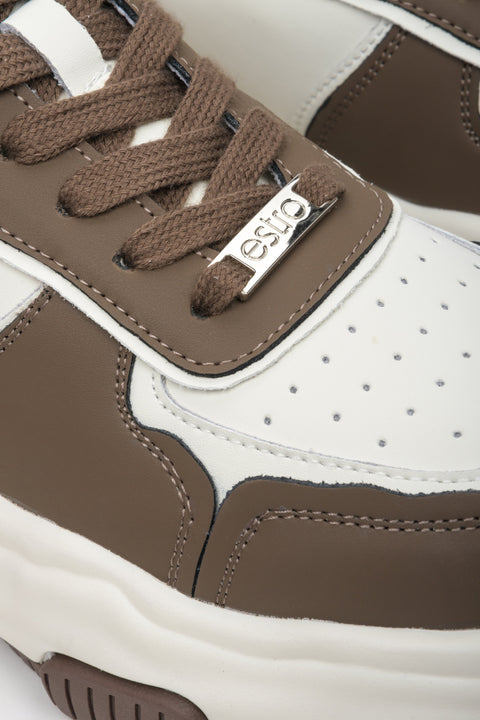 Women's leather sneakers in brown and white by Estro - close-up on the details.