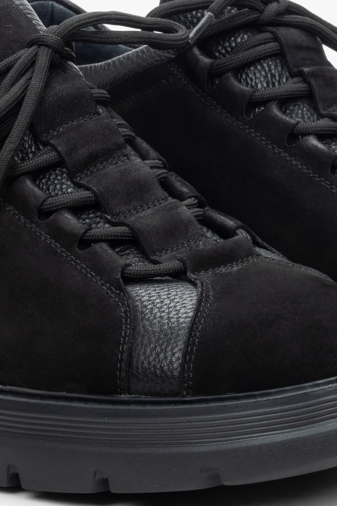 Men's black lace-up sneakers made of nubuck and leather - close-up on details.