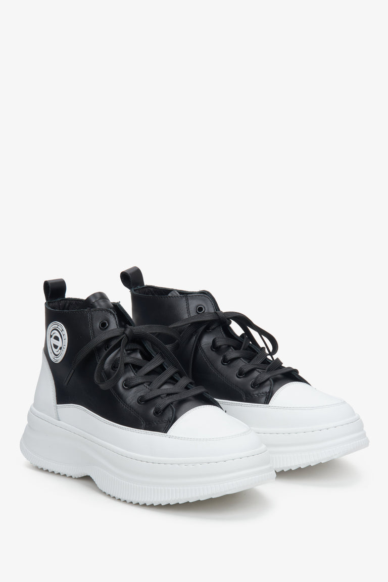 Women's black and white natural leather sneakers - presentation of a shoe toe and sideline.