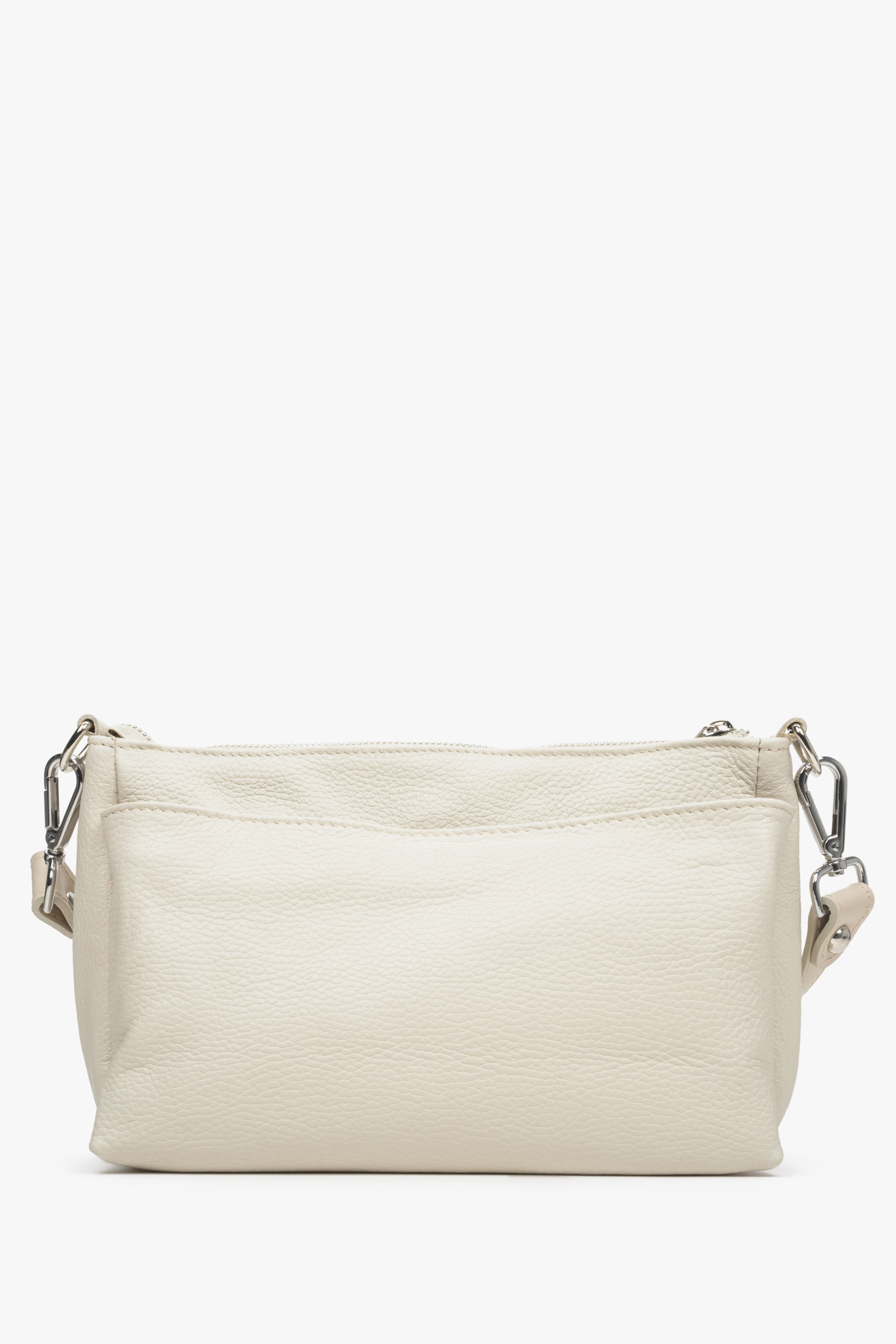 Women's light beige Estro crossbody bag made from genuine leather with a zipper.