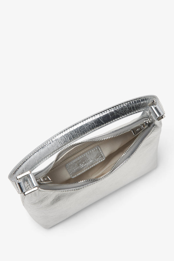 Eclectic women's silver patent leather handbag - a close-up on the main compartment.