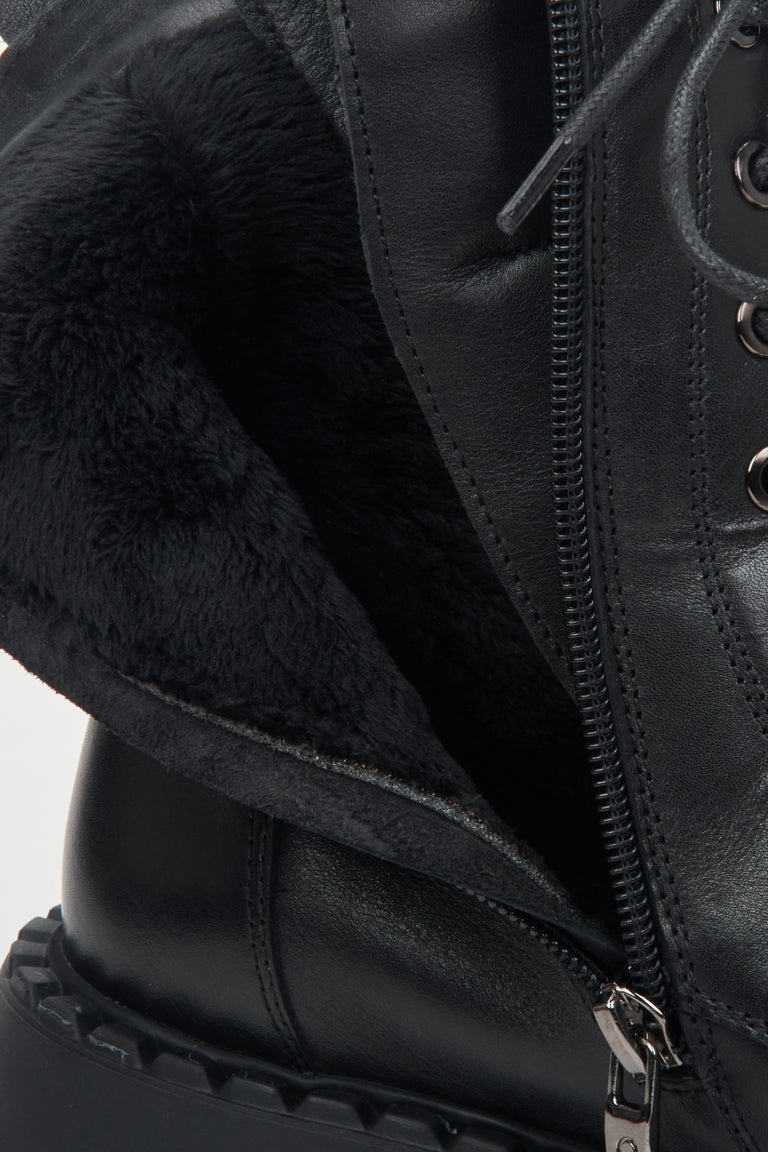 Women's black leather Estro combat boots - close-up on the insulating fabric inside.