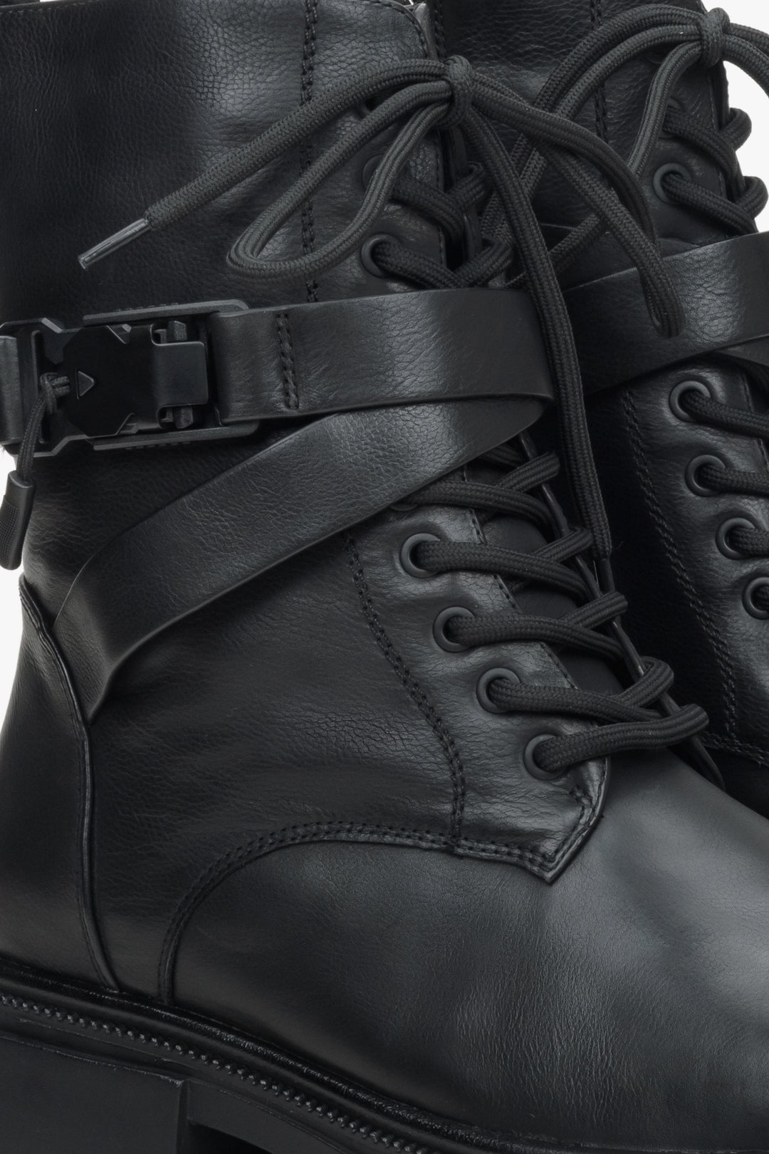 Women's black leather winter boots - close up on details.