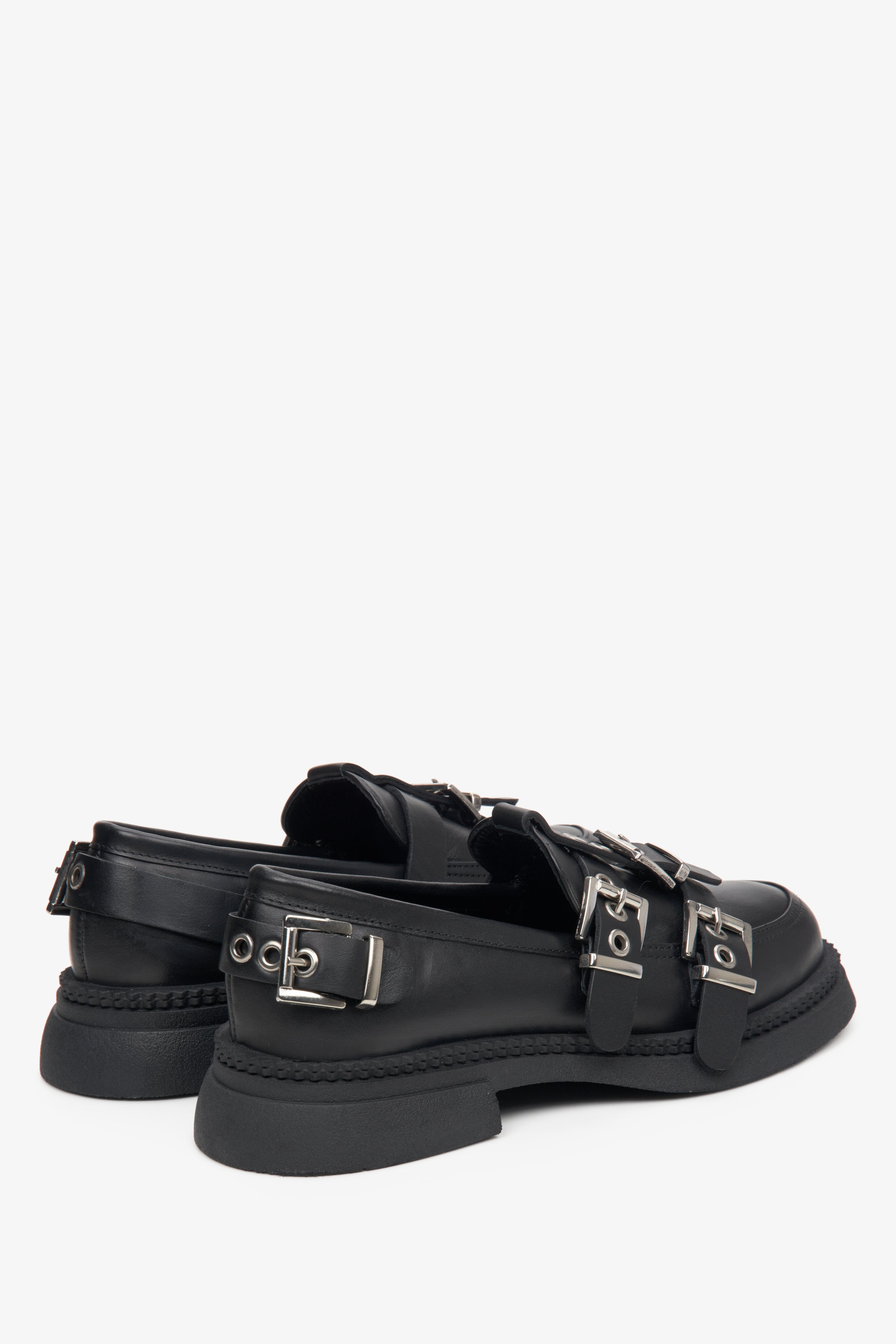  Women's black leather loafers with buckles by Estro - close-up on the heel and side line of the shoe.