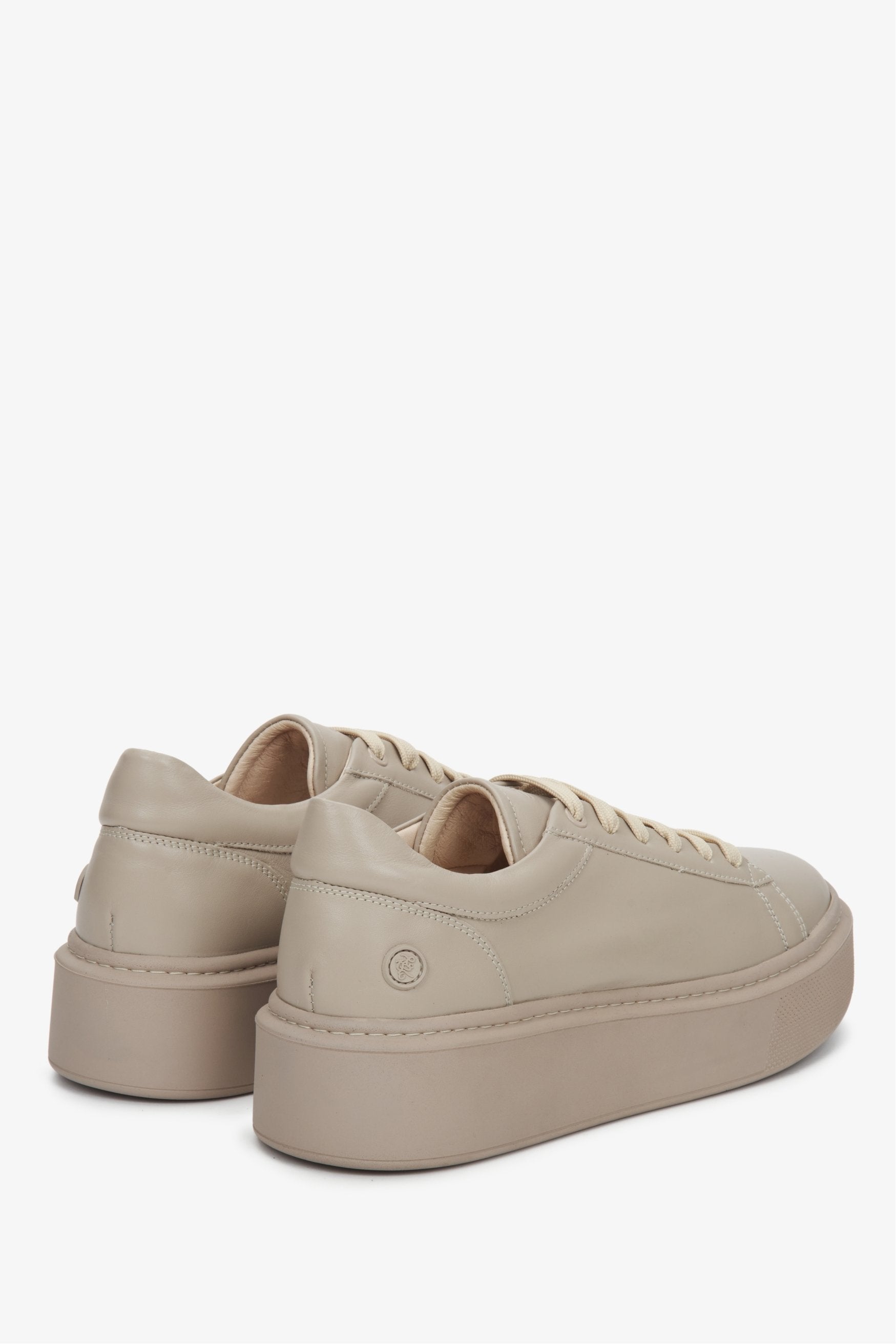 Soft women's sneakers made from genuine leather by Estro in beige.