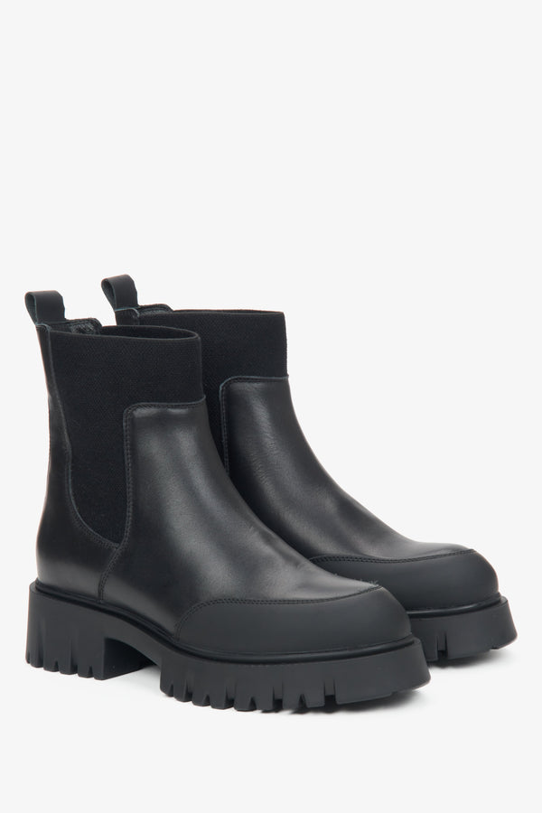 Women's black leather ankle boots for winter.