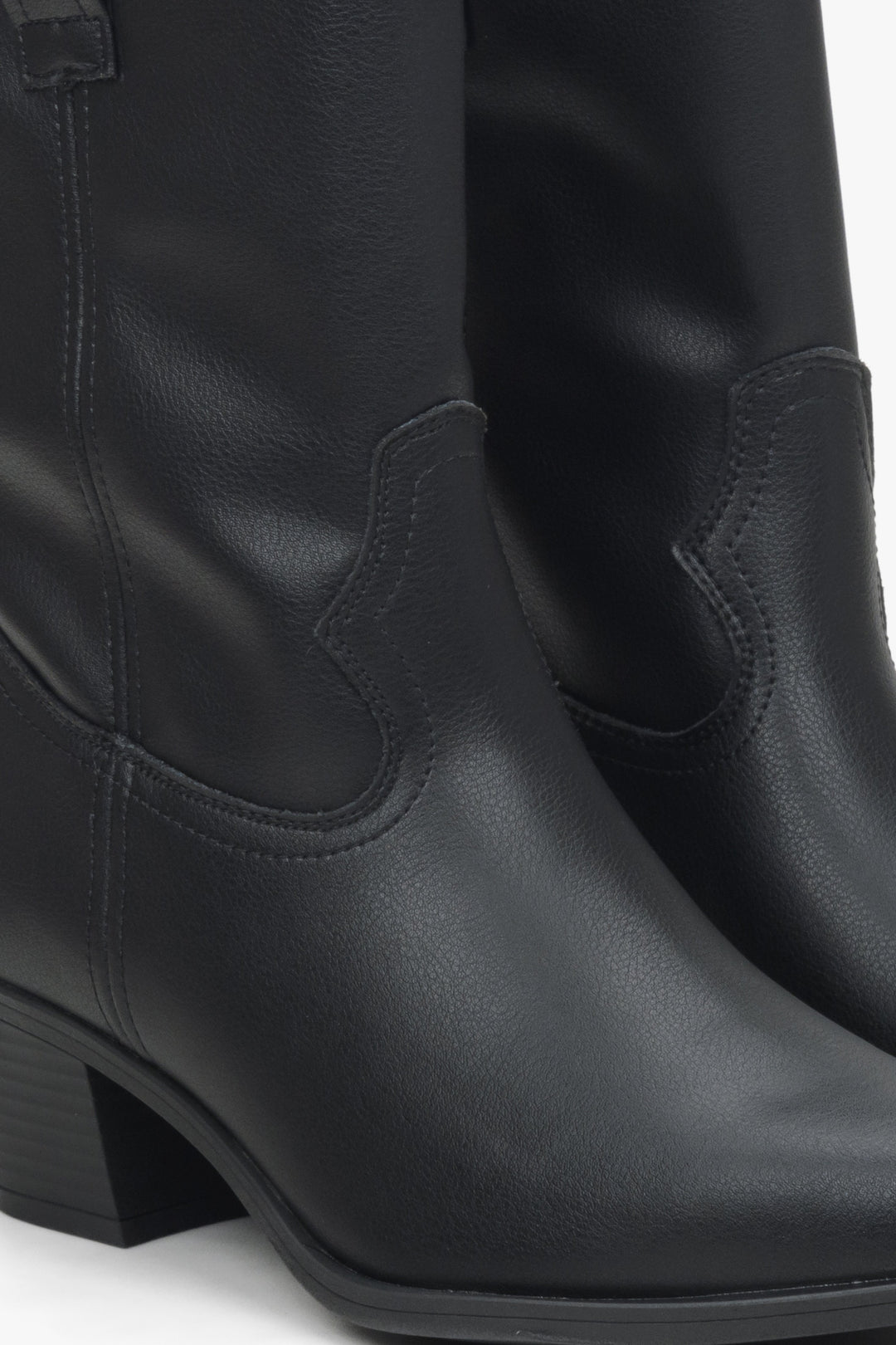 Women's black low-cut cowboy boots made of genuine leather by Estro - close-up on details.