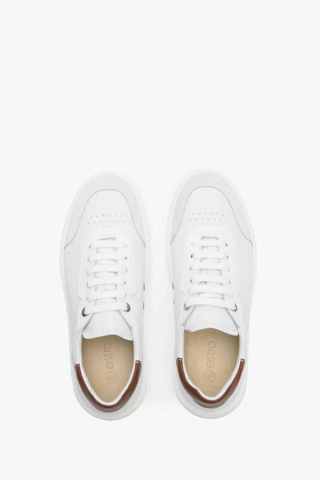 Casual white men's sneakers on an elastic, rubber sole - presentation from above.