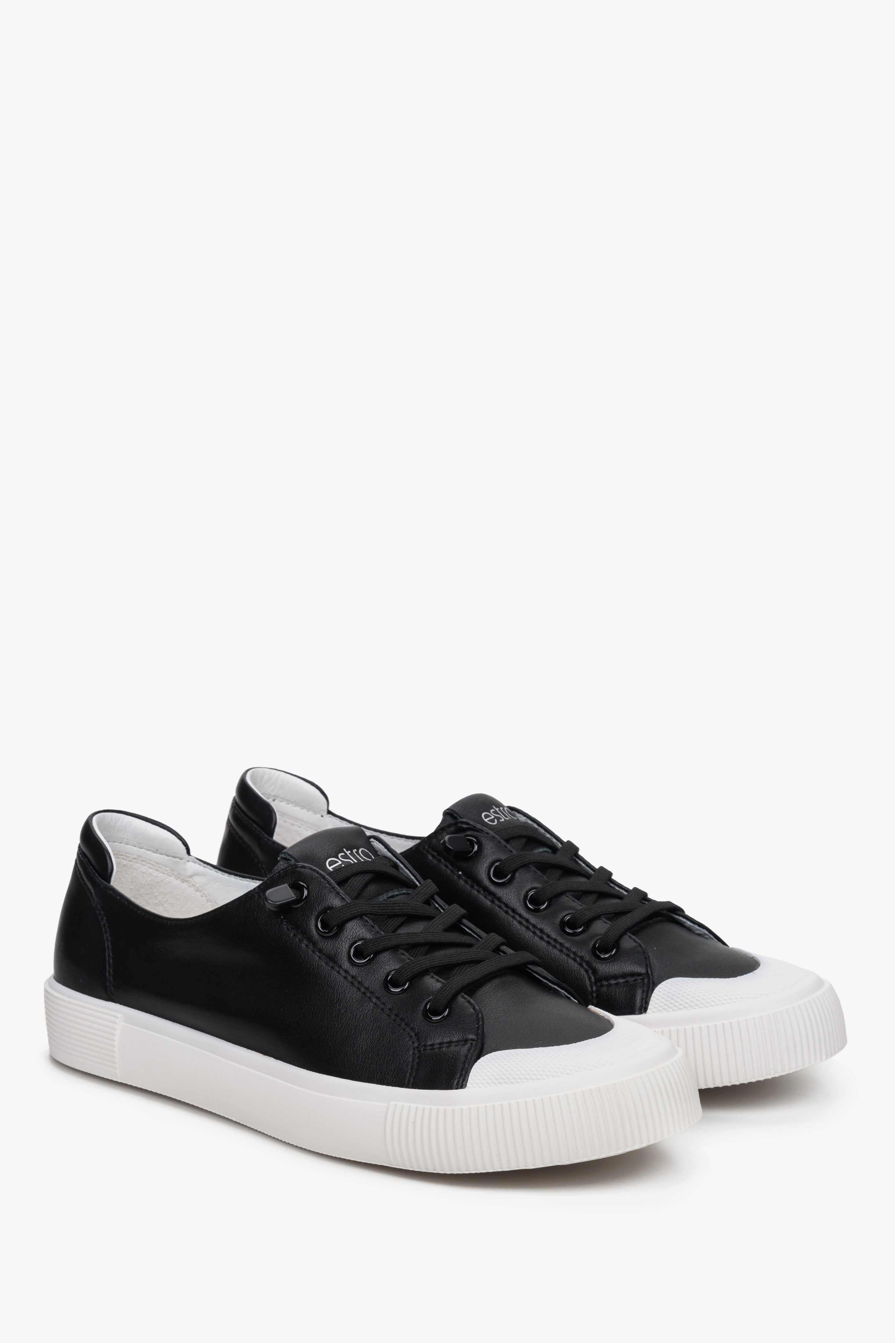 Women's black sneakers made of genuine leather by Estro, laced.