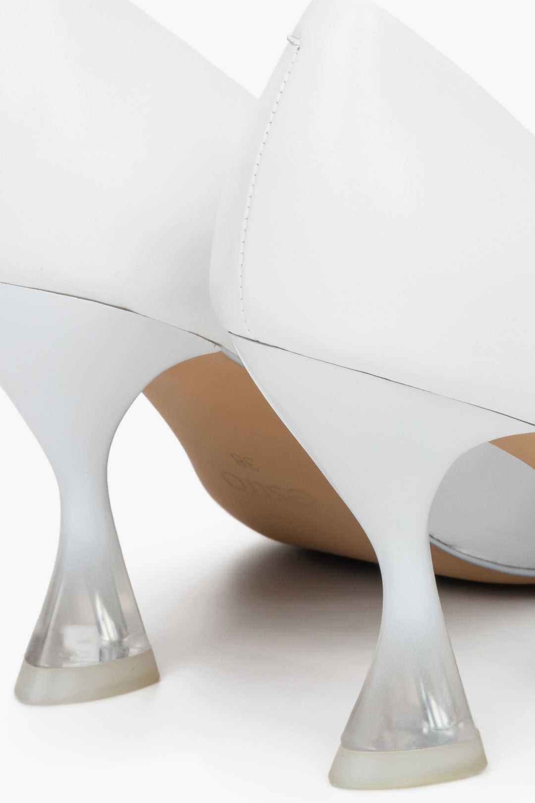Women's white leather high-heeled pumps by Estro - close-up on the heel.