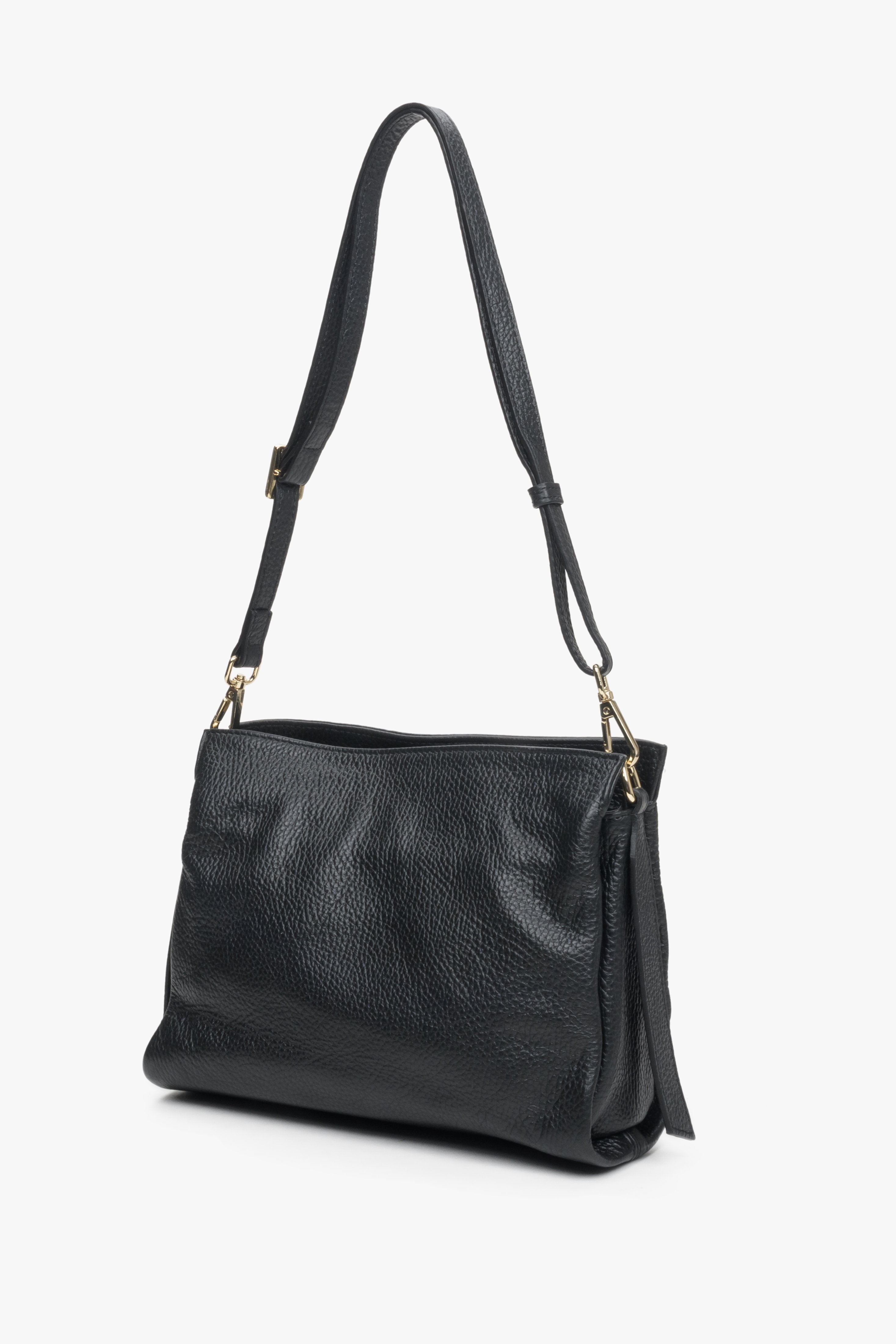 Black leather women's crossbody bag by Estro with a long strap.