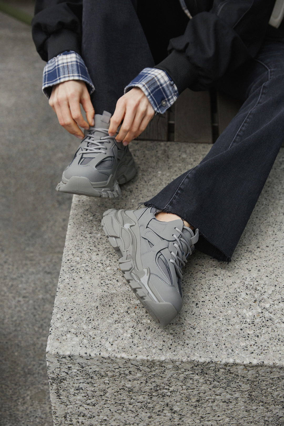 Women's grey sneakers with a trick sole made of genuine leather - presentation on a model.