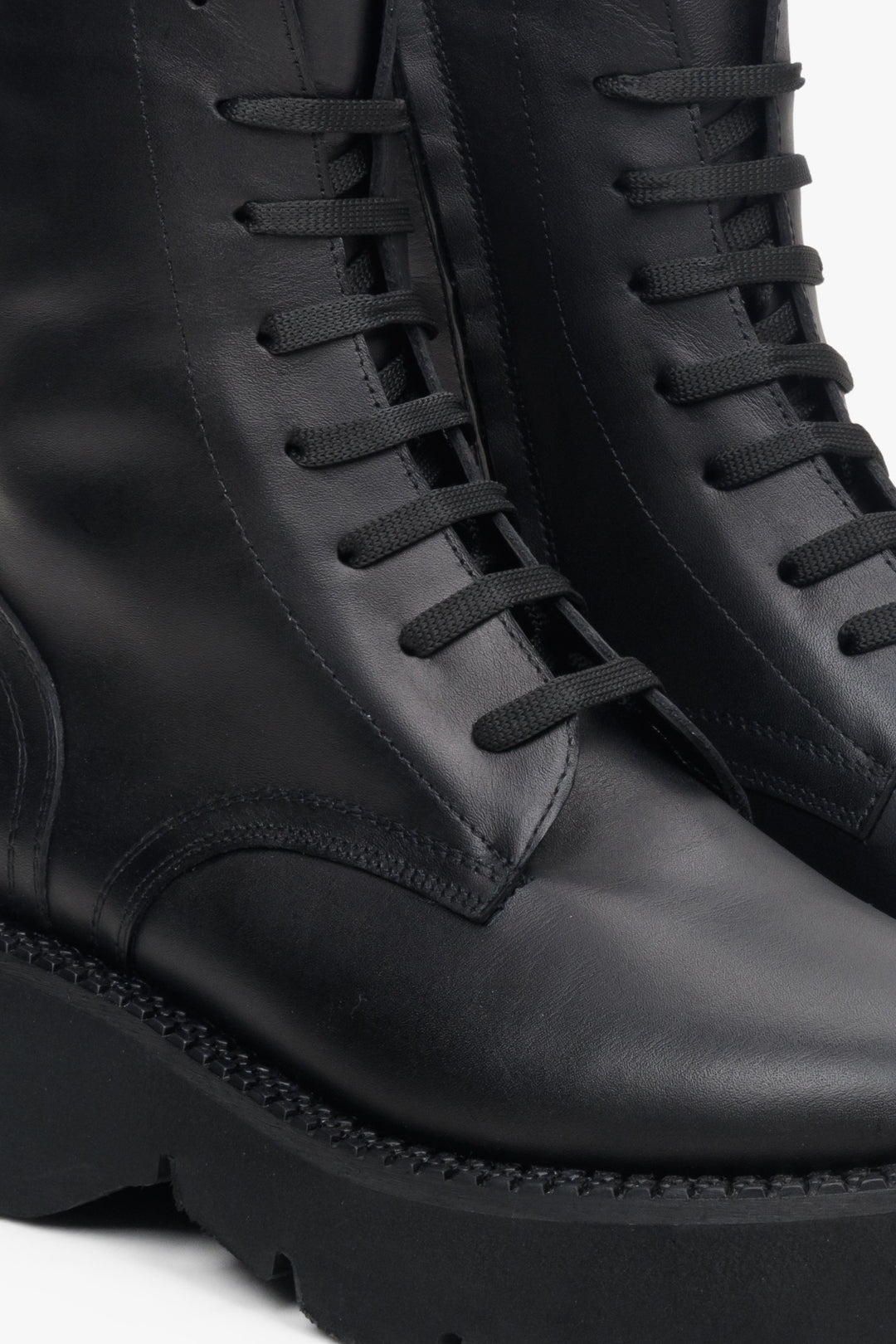Women's black leather  winter boots by Estro - close-up on the lacing system.