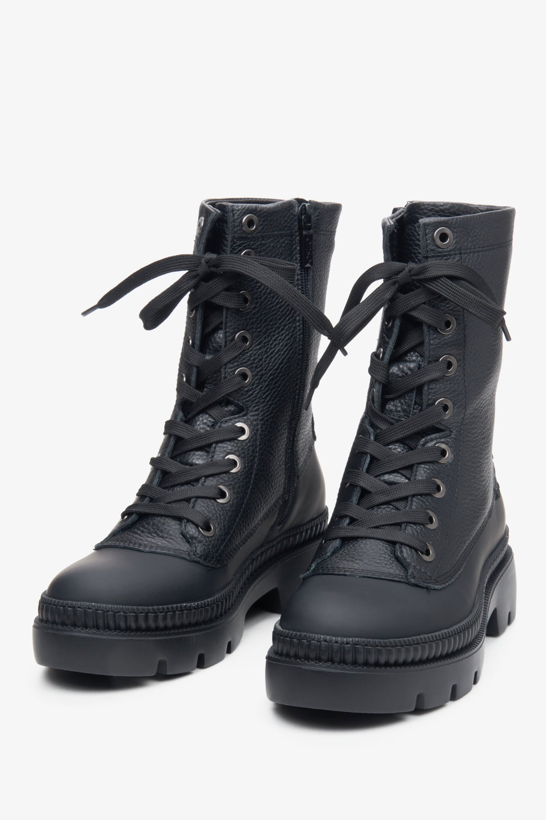 Women's black leather ankle boots in black with decorative lacing.