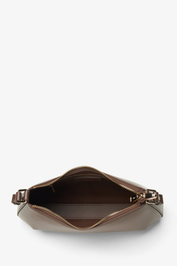 Women's brown leather handbag - a close-up on the main compartment.