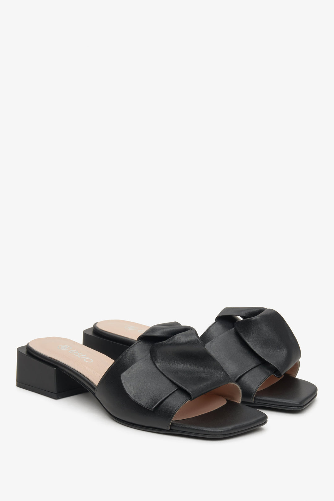 Women's black leather mules with a bow by Estro.