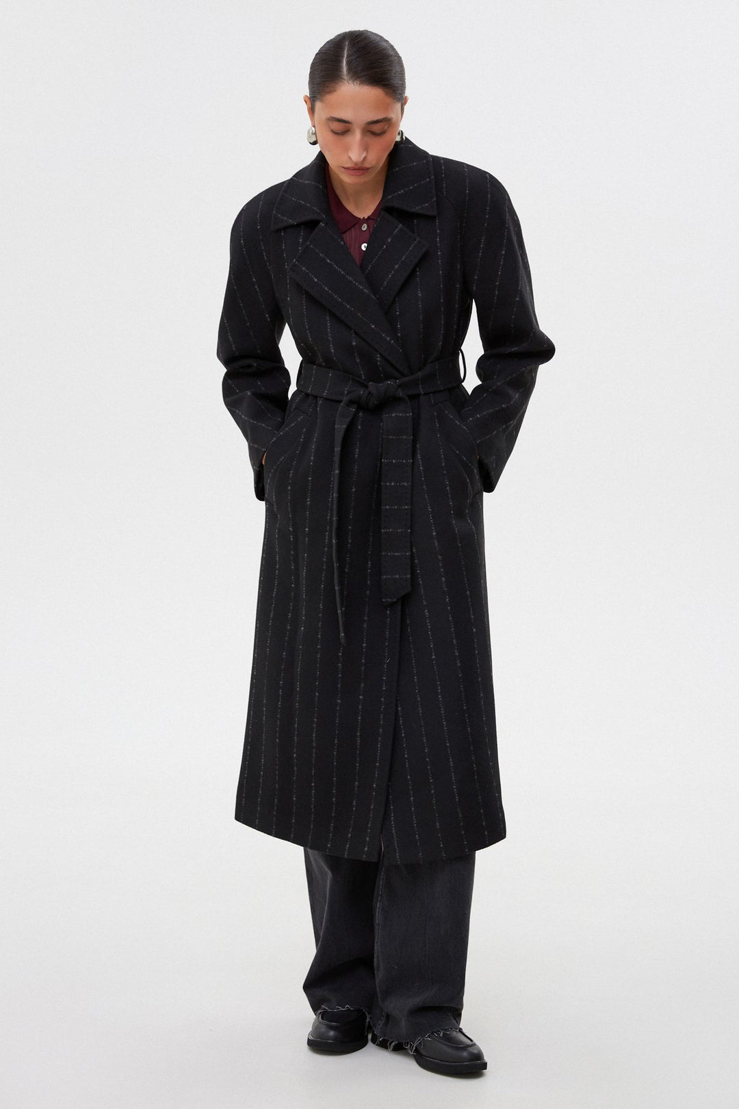 Long black pinstripe coat by Estro.