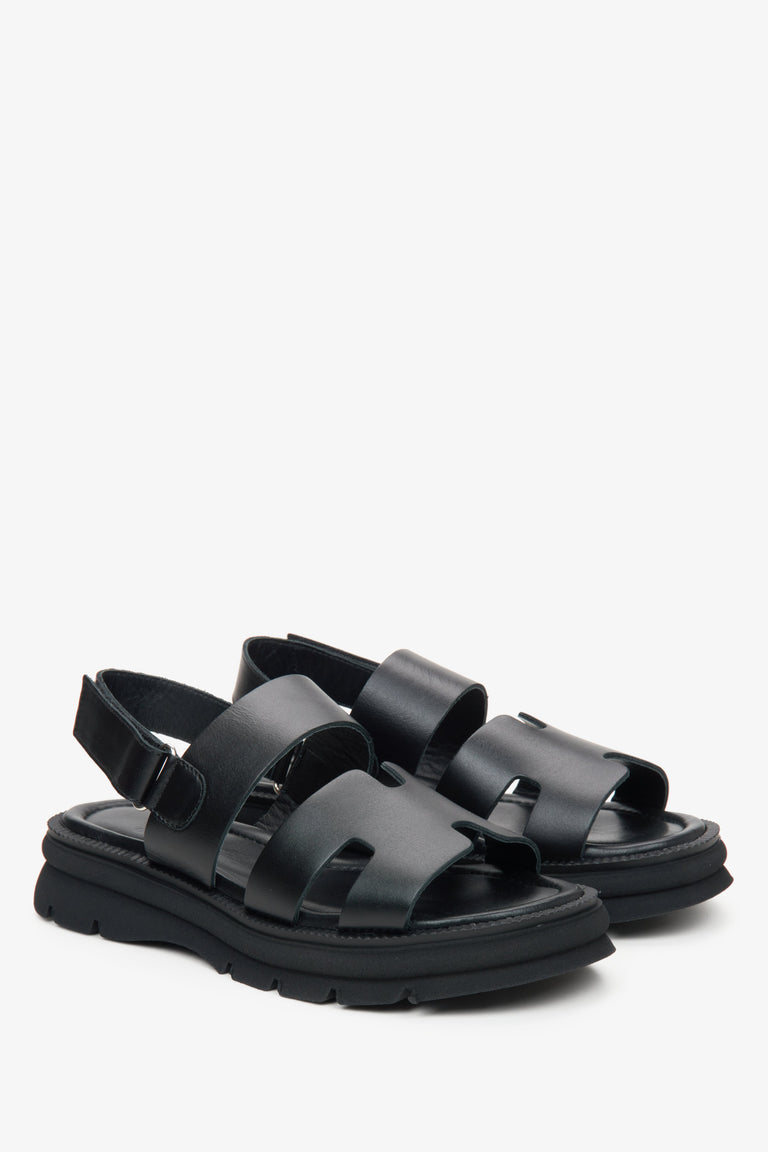 Women's black leather sandals with a flexible sole by Estro.