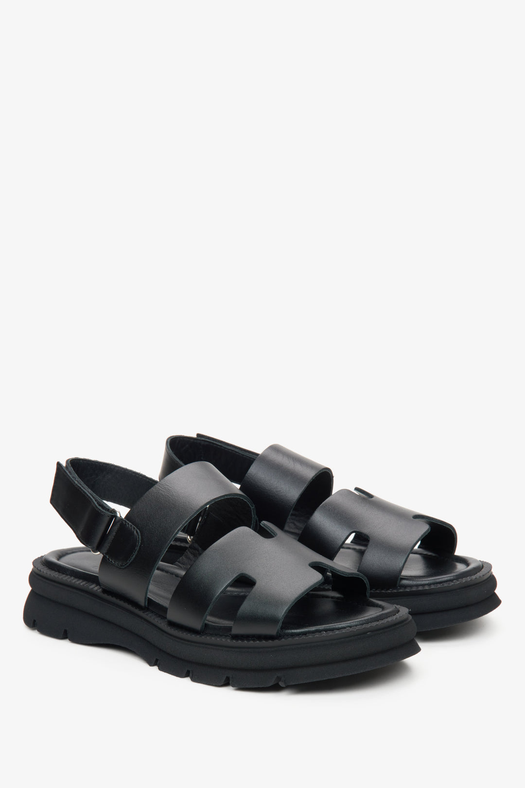 Women's black leather sandals with a flexible sole by Estro.