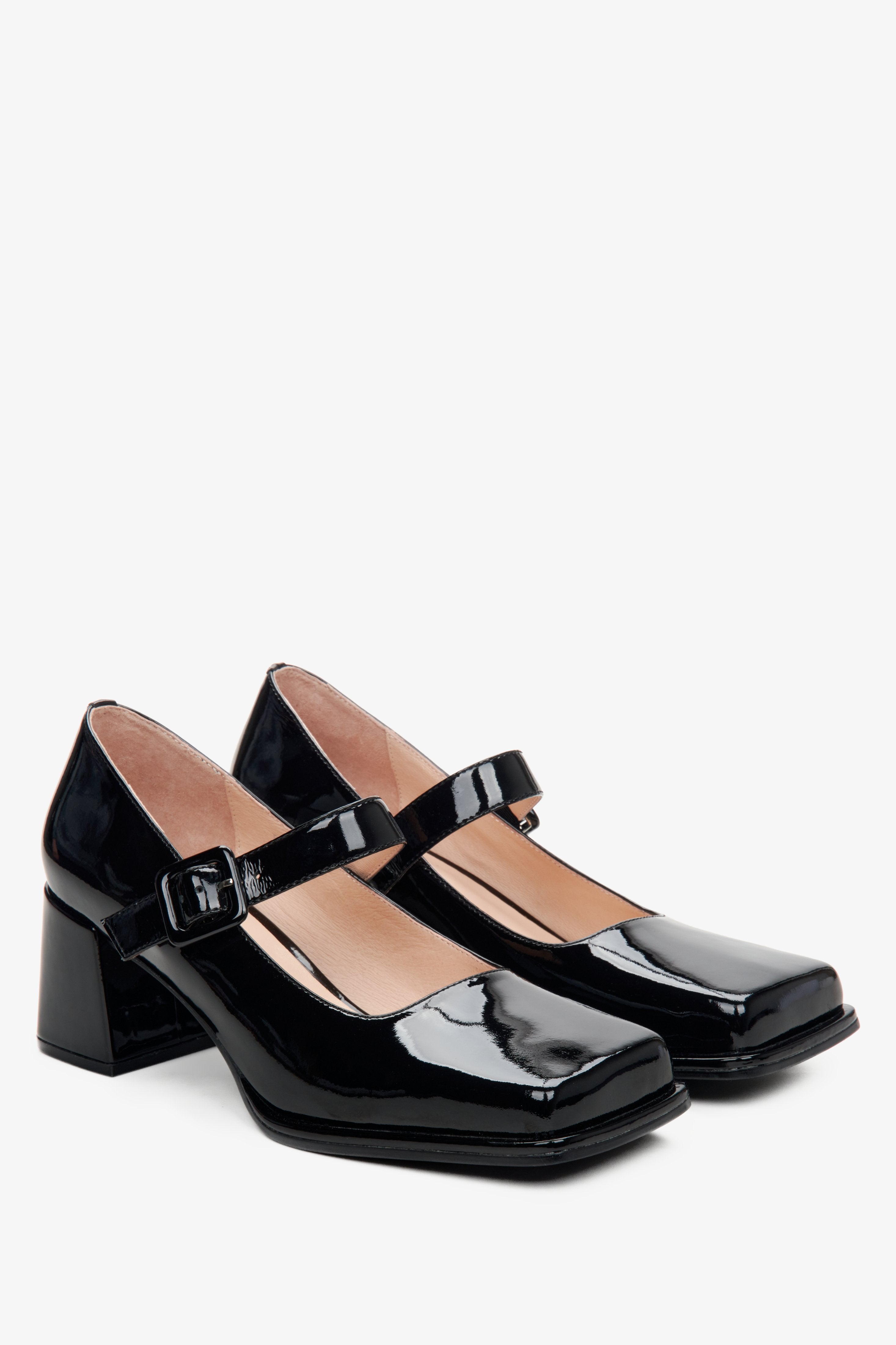 Women's black leather patent Mary Jane pumps.