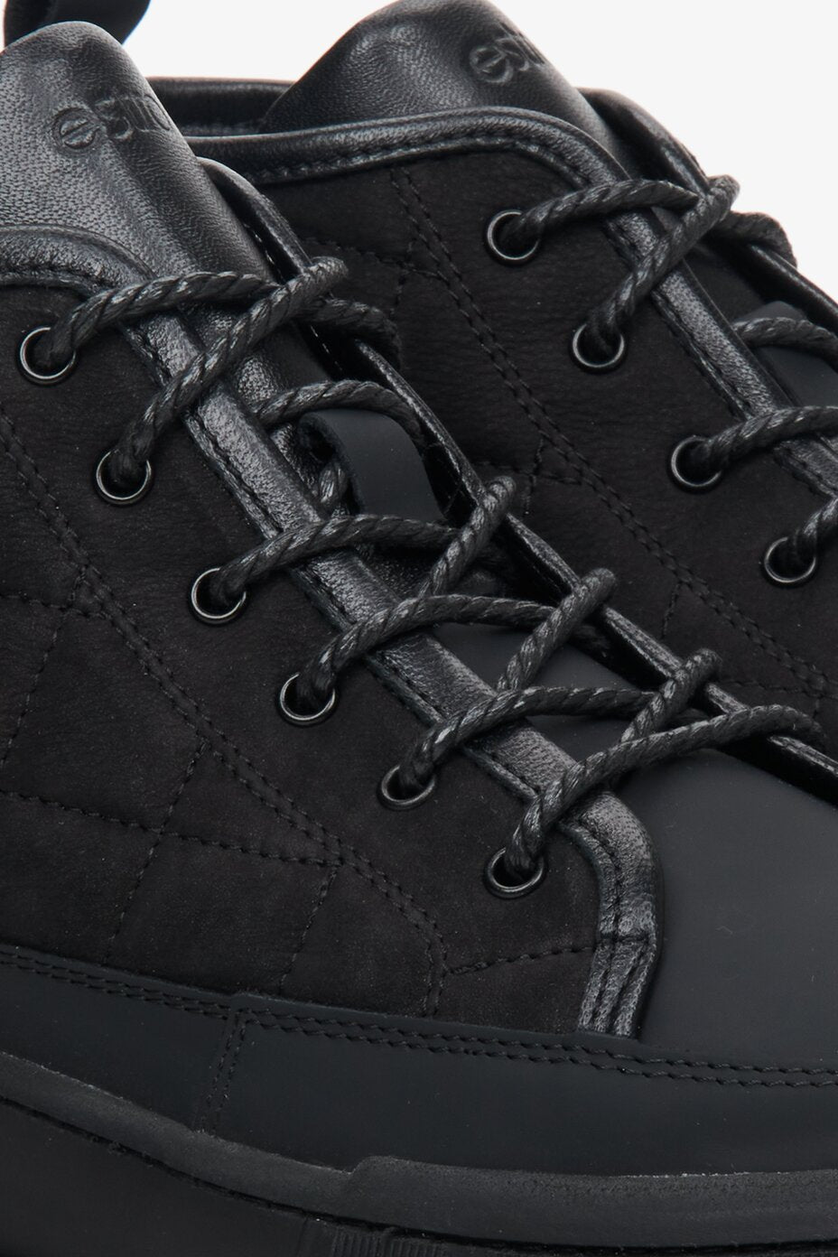 Black, high-top Estro men's winter boots - close-up of the lacing system.
