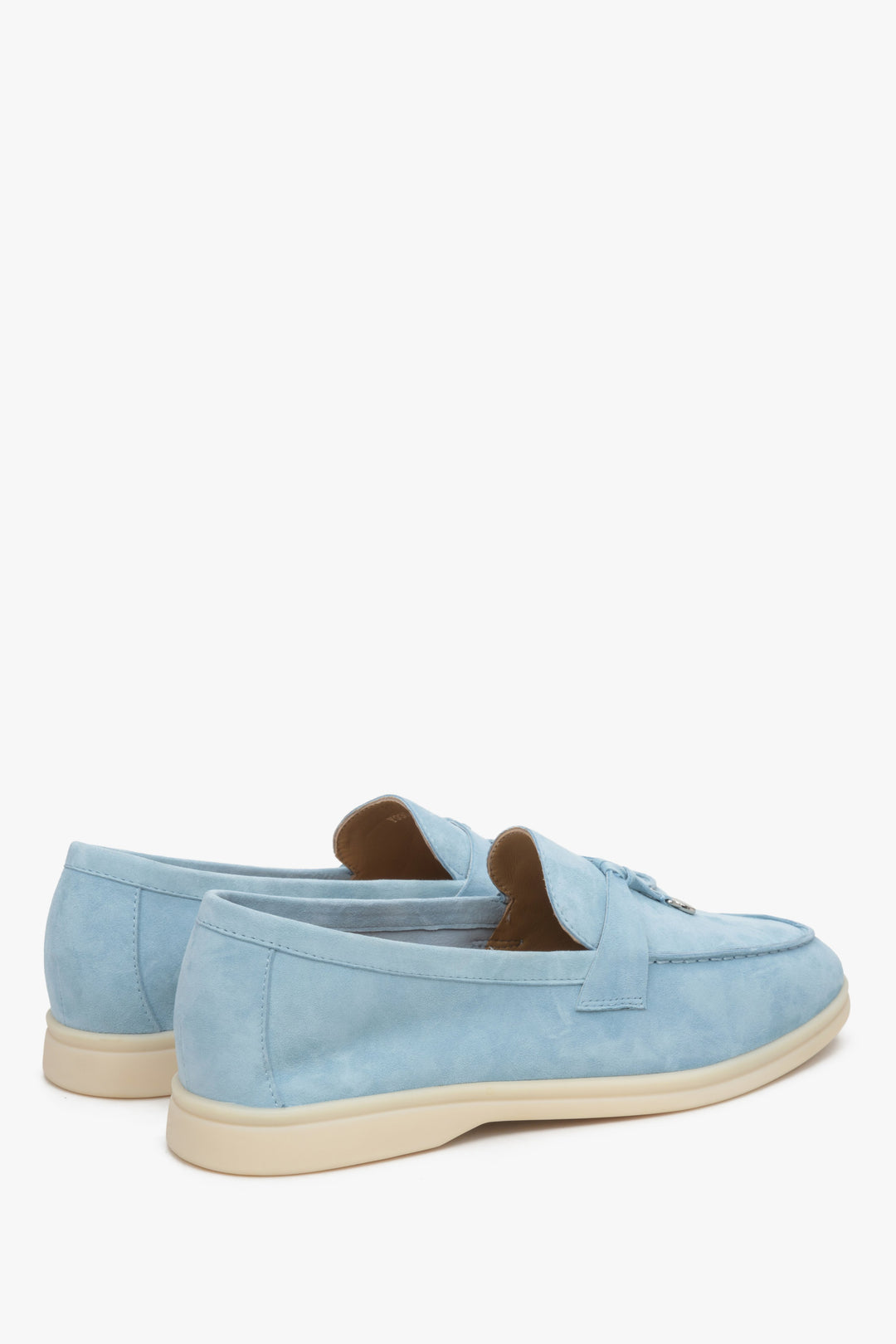 Light blue women's loafers made of natural velour and leather - close up on heel counter.
