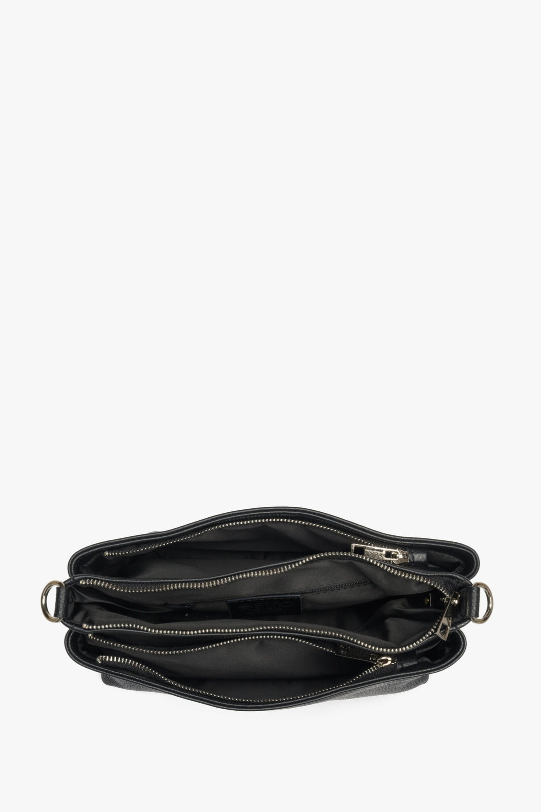 Women's black Estro crossbody bag made from genuine leather - close-up on the interior of the model.