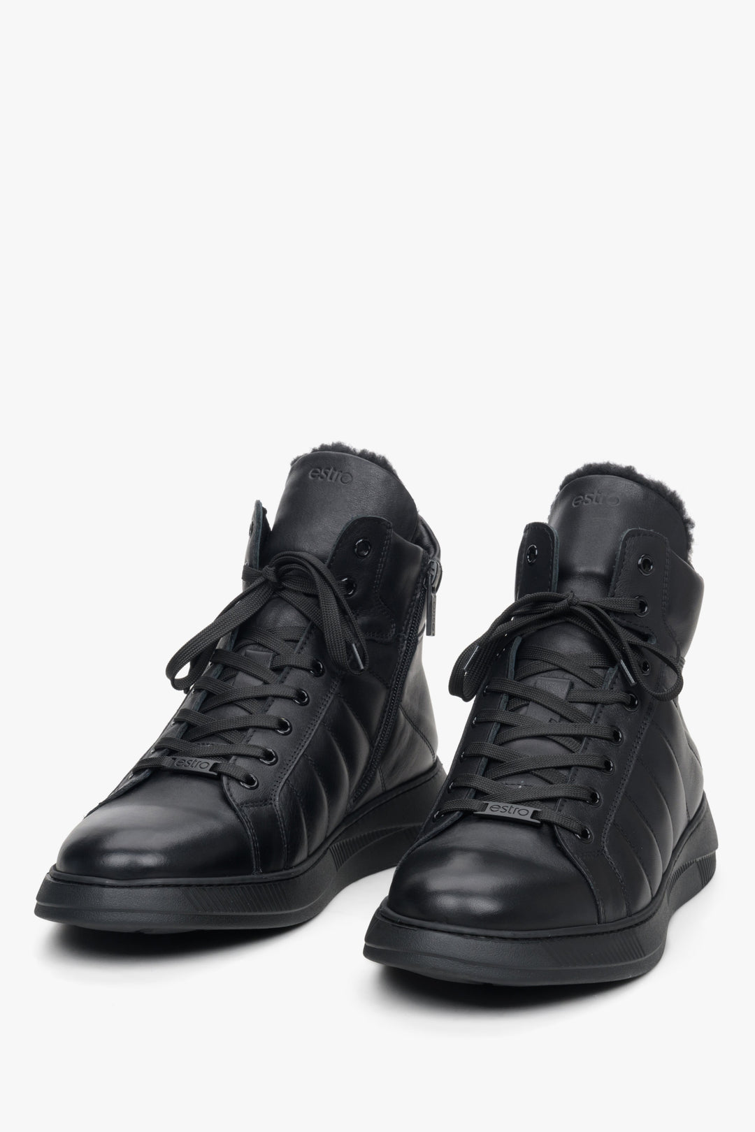 Men's black leather sneakers with fur lining by Estro - close-up on the toe of the shoe.