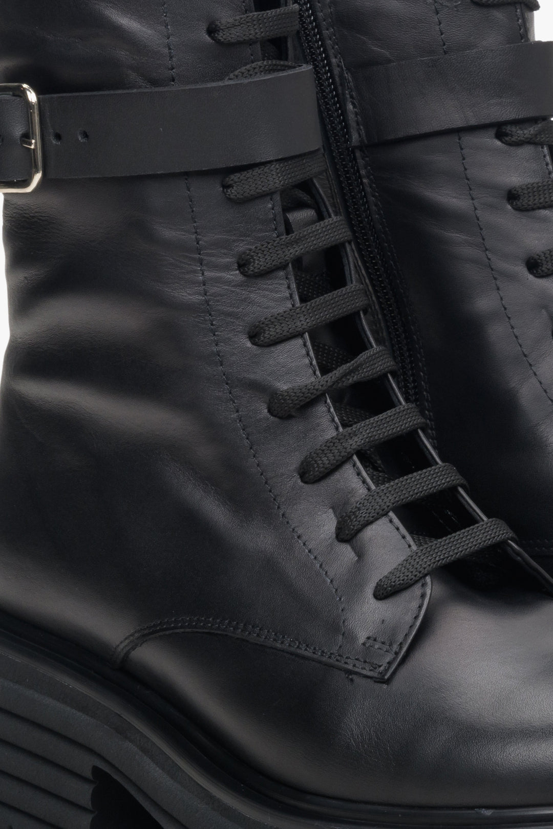 Women's black leather boots by Estro - close-up on the lacing system.