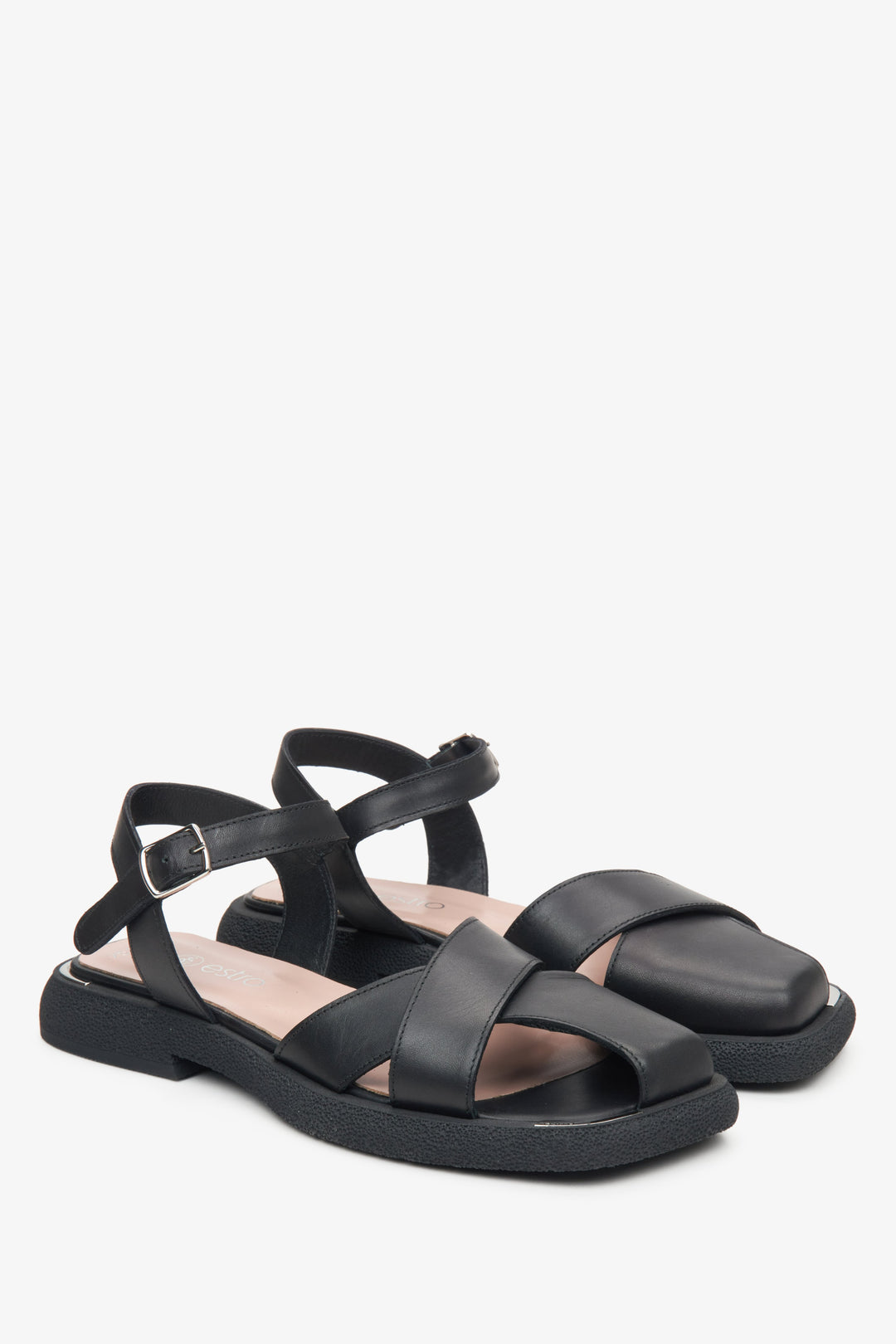 Black leather sandals with criss-cross straps by Estro.