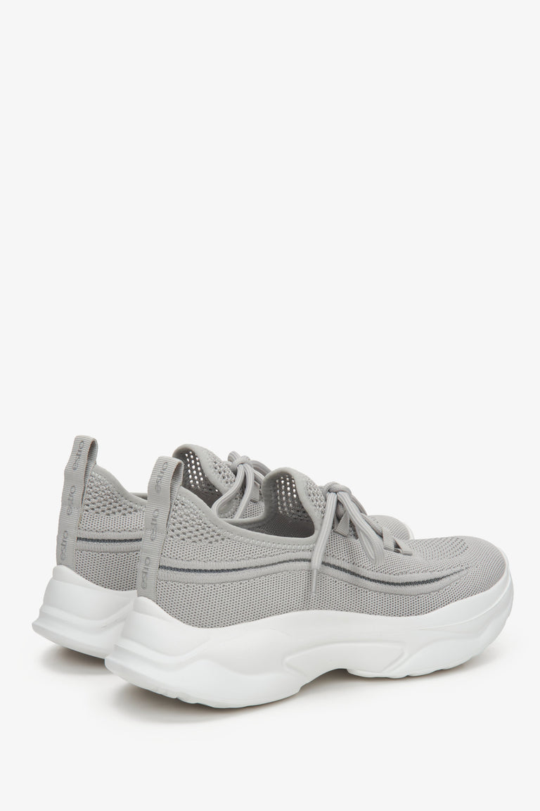 Grey low-top mesh women's sneakers - a close-up on heel counter.