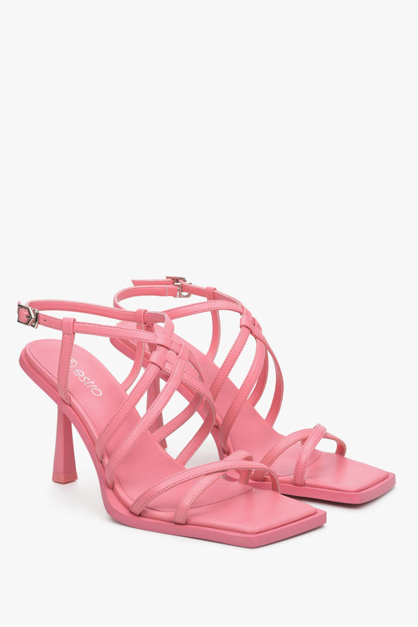 Pink women's strappy sandals on a funnel heel, Estro brand.