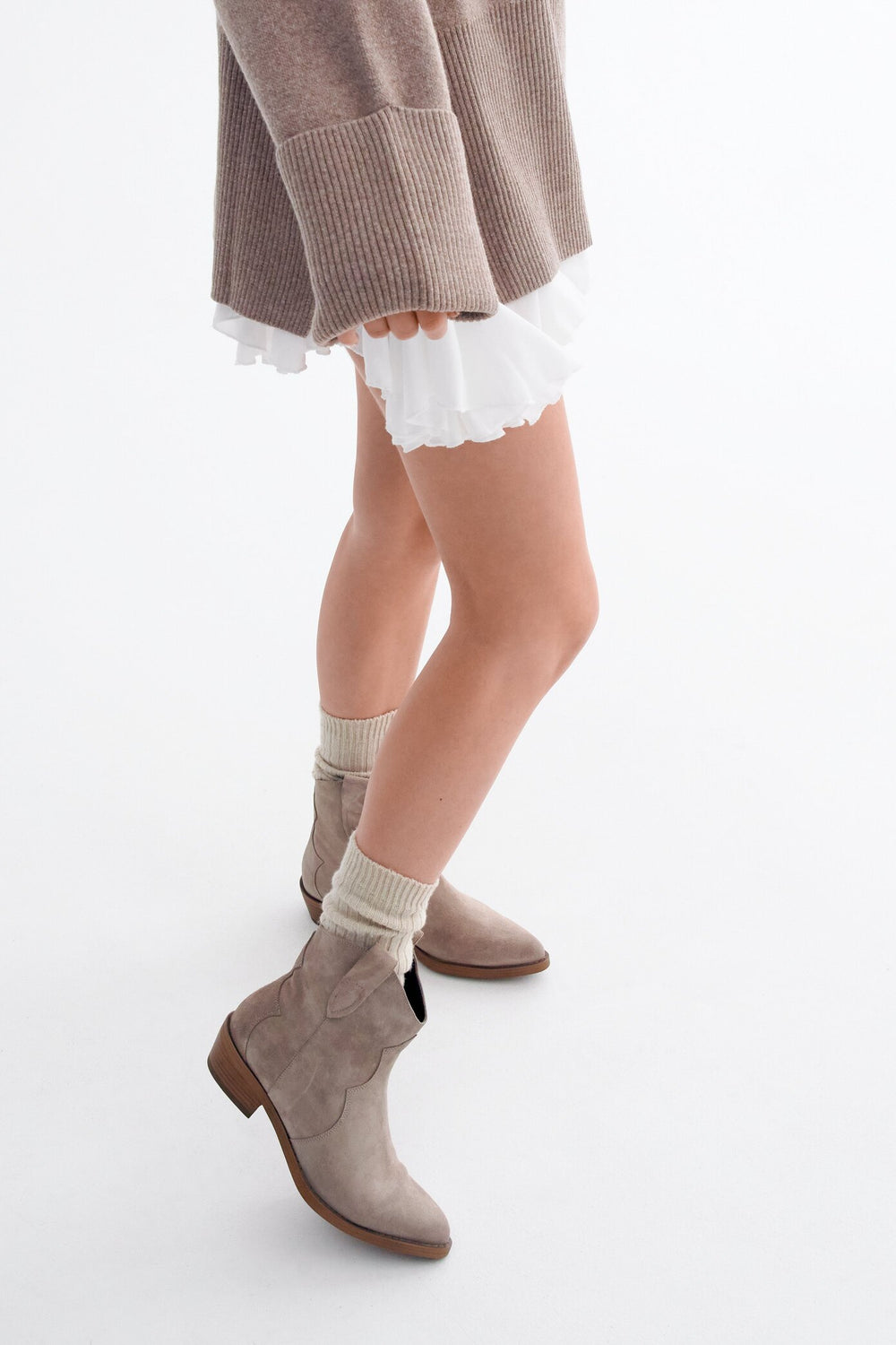 Women's beige cowboy boots in genuine velour by Estro - presentation on a model.