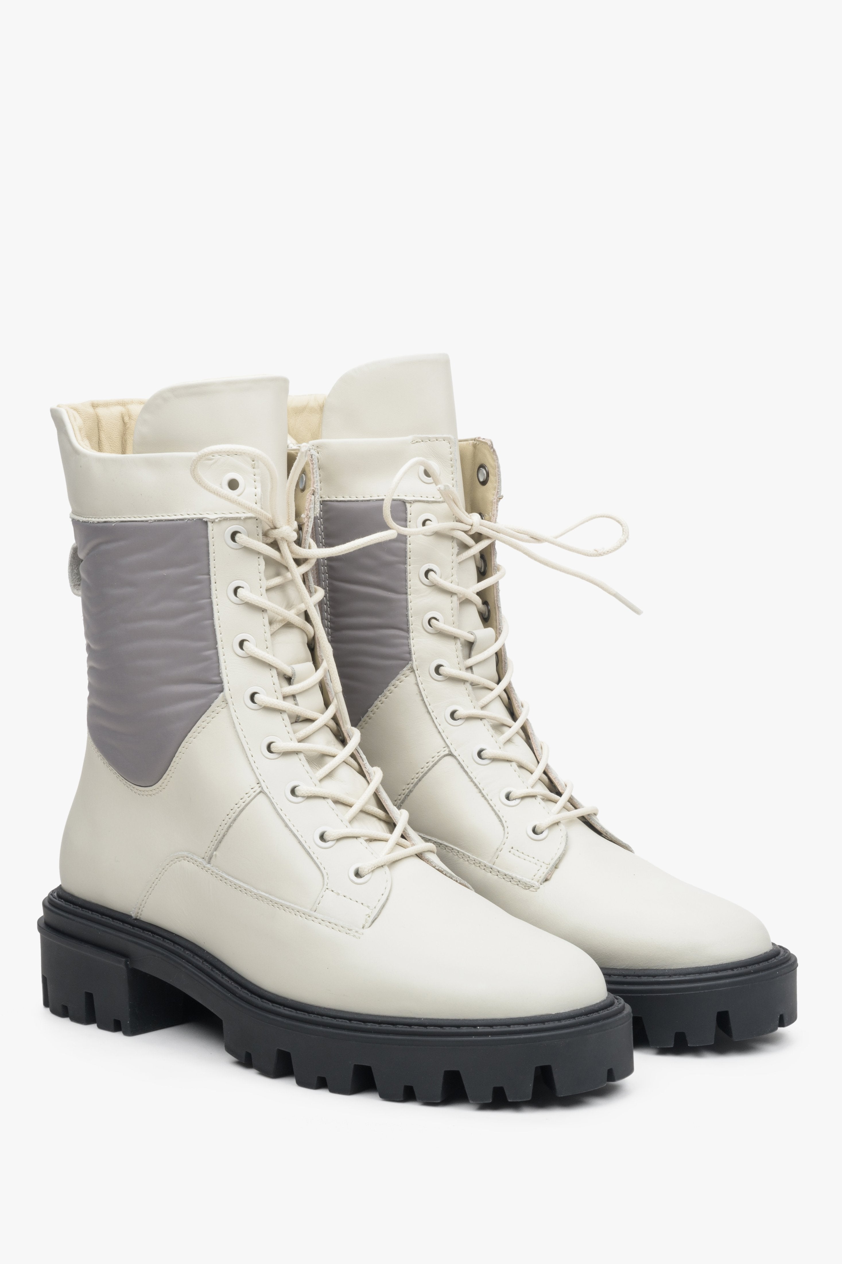 Stylish women's leather ankle boots in beige-grey with a buckle.