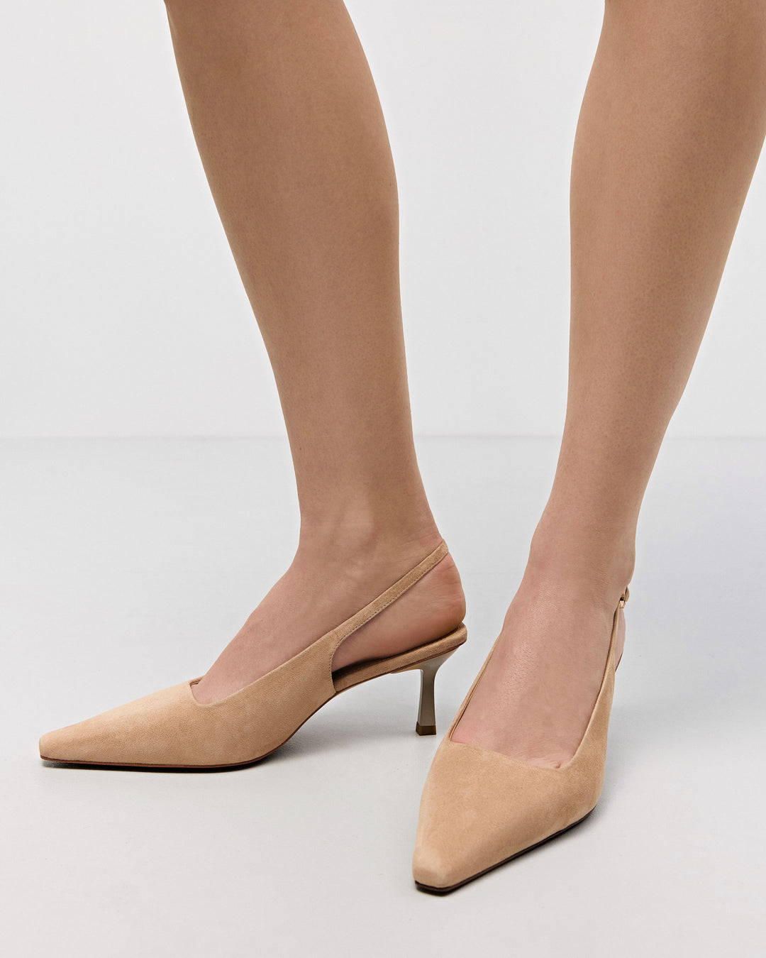 Comfortable beige slingback heels for women by Estro, made of velour, with a low heel – shown on foot.