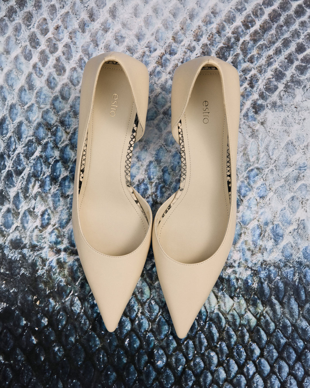 Elegant beige women's high heels made of genuine leather – top view presentation.
