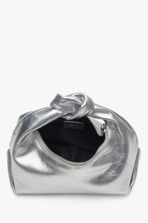 Close-up of the interior of the small silver women's evening bag by Estro.
