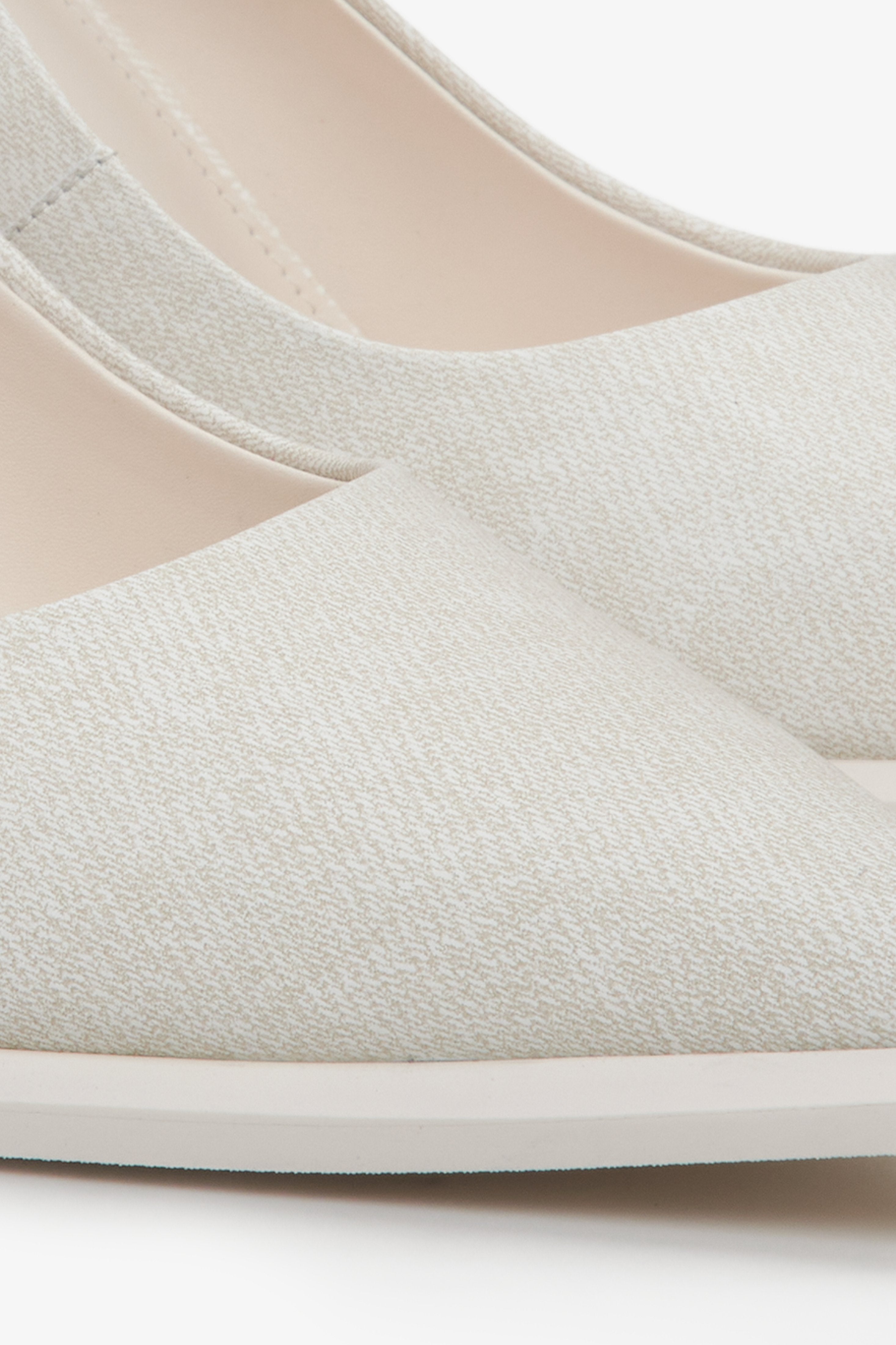 Light beige textured denim women's pumps by Estro - close-up on detail.