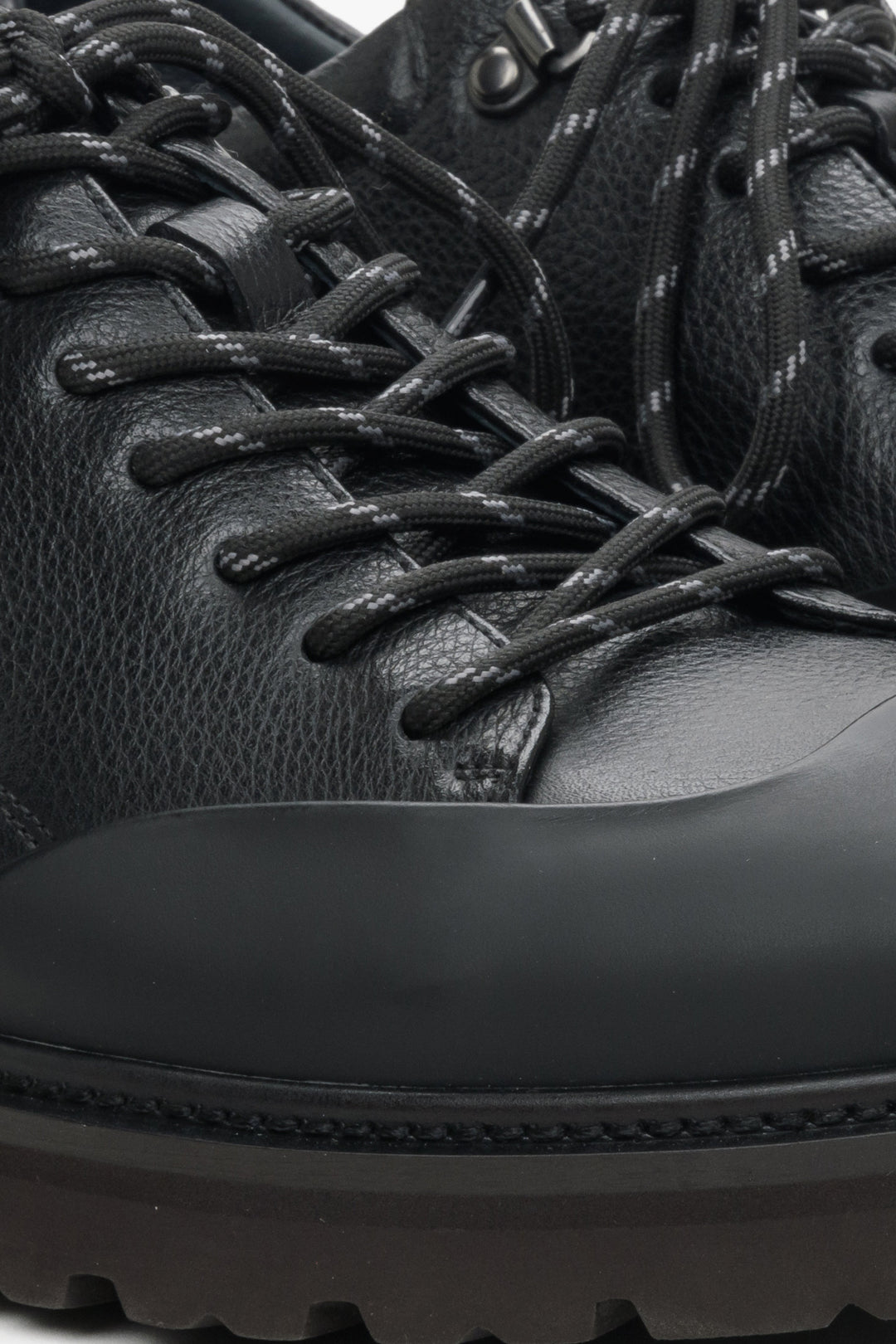 Men's black leather loafers - close-up on the details.