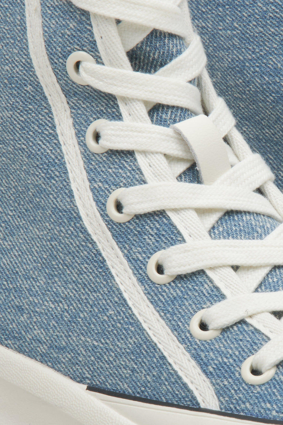 High-top athletic women's sneakers by Estro in blue - close-up on details.