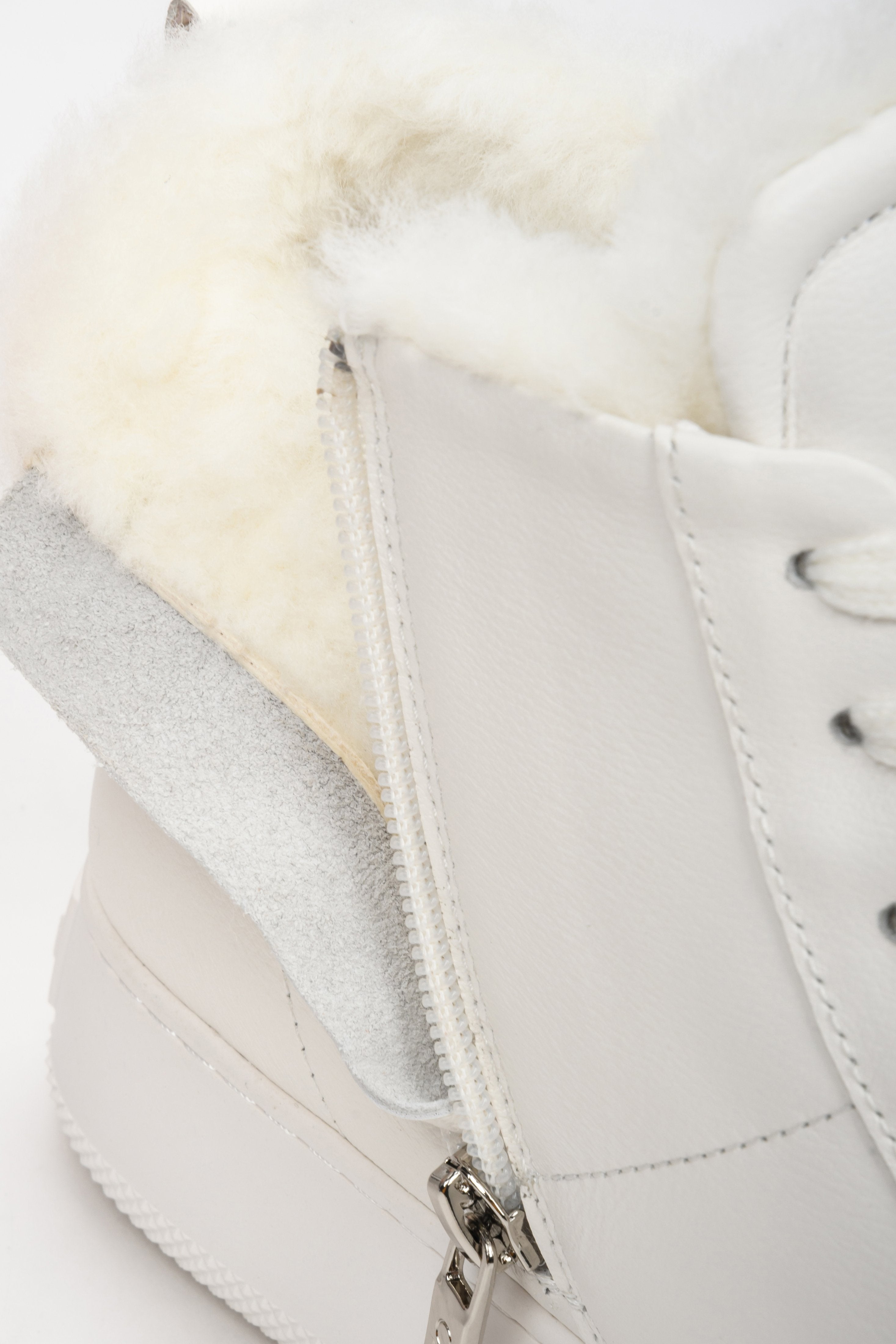 Women's white winter sneakers - close-up on the soft shoe lining.